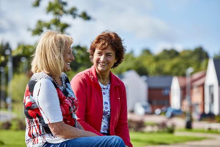Two women sitting outside
