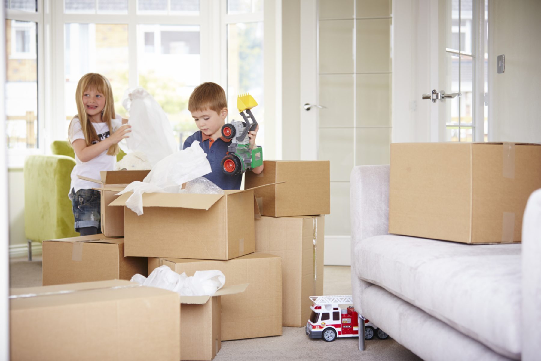 Brother and sister unpacking